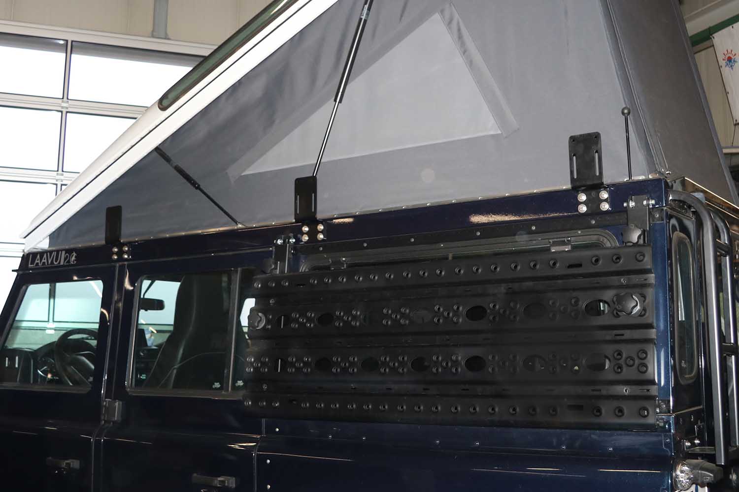 Awning bracket for pop-up roof frames