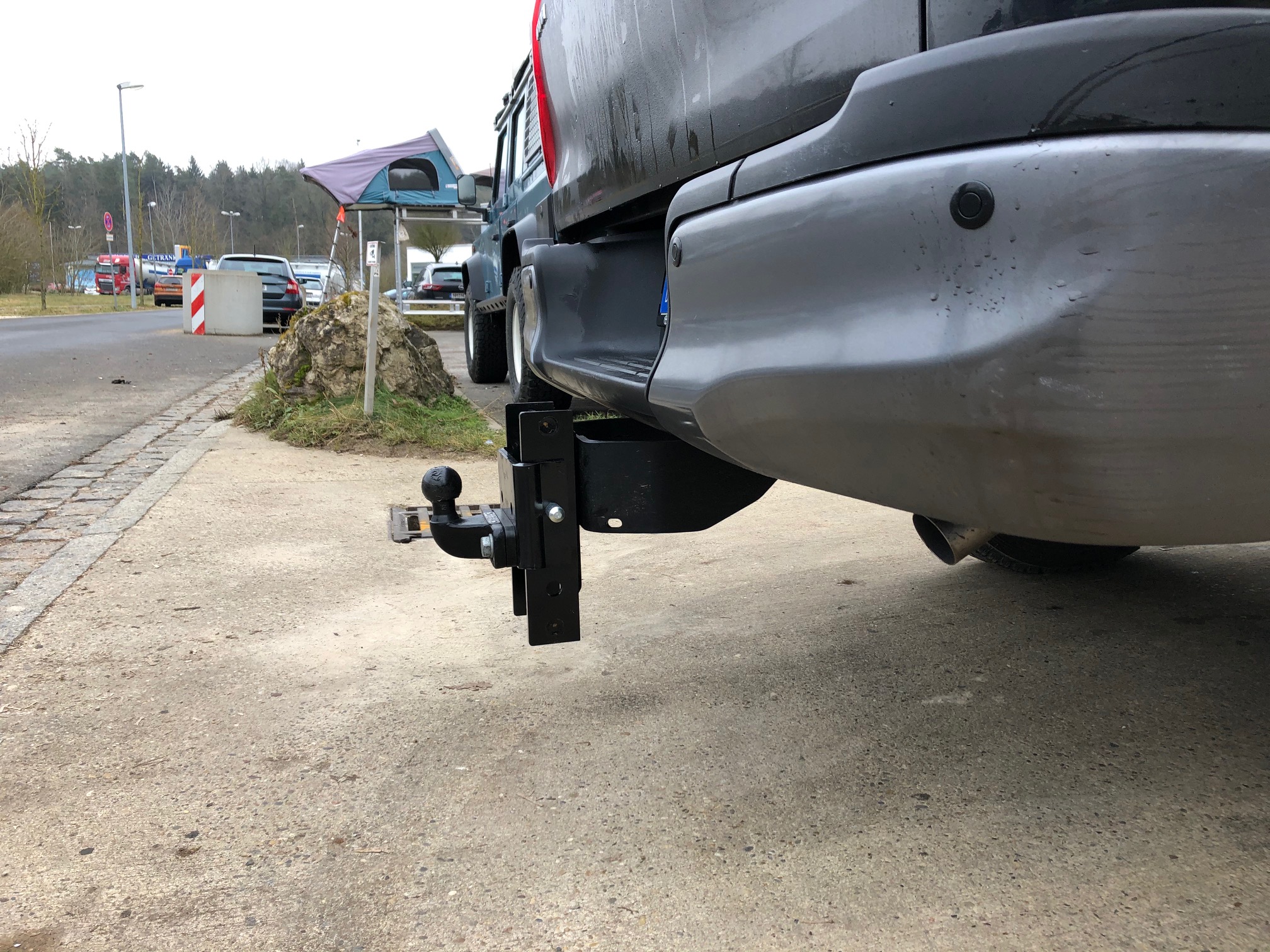 Side view of adjustable tow bar hitch with towball fitted