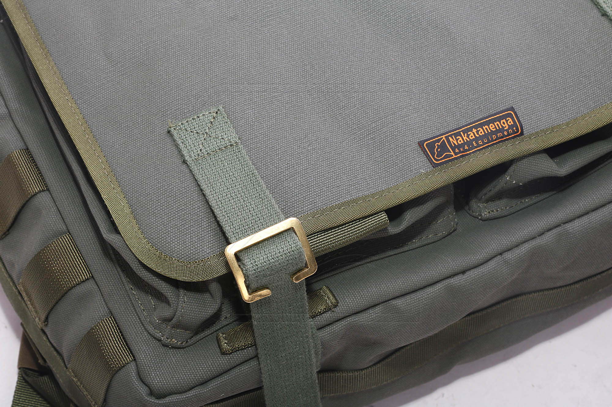 Close-up of Nakatenga 4x4 green canvas shoulder bag