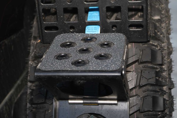Anti-slip pads for spare wheel tread